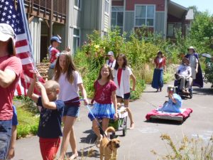 Sporting red, white, and blue with Lady Liberty on a float.