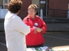 karen-greeting-visitor-at-earth-day-coho-booth